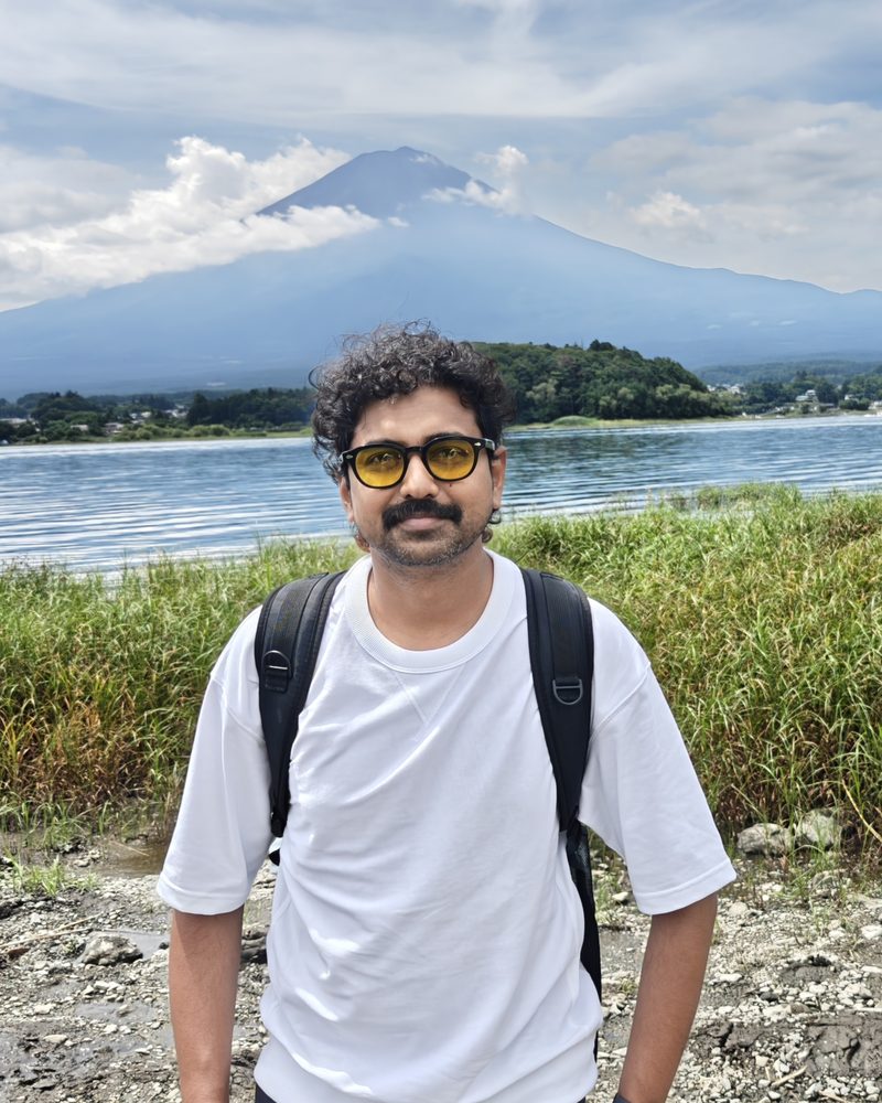 Shefeek Jinnah by a lake near Mount Fuji